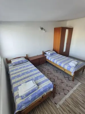 a room with two beds in a room at Вилла Яна in Sveti Vlas