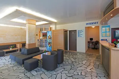 an office with a lobby with couches and a bar at Paloma - in the center of the city in Sunny Beach