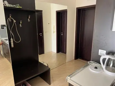 a kitchen with a black cabinet and a counter top at Midia Grand Resort Aheloy in Aheloy