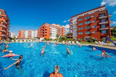 a group of people in the water in a swimming pool at Roof top sea view apartment 167,2ložnice,4-7 osob in Sveti Vlas