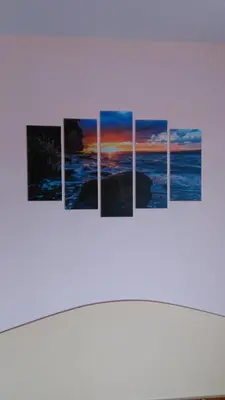 a group of four pictures hanging on a wall at Guest House Aristokrat in Obzor