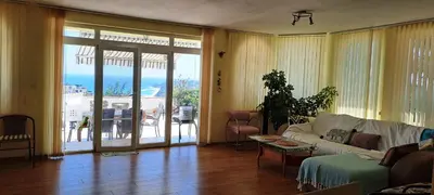 a living room with a couch and a table at Villa Byala Grape House in Byala