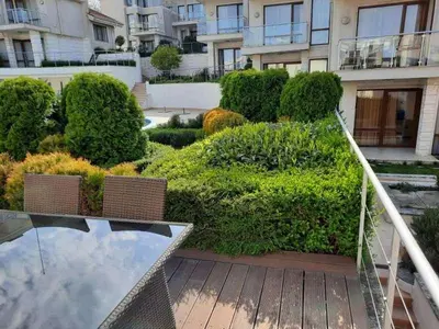 a view of a garden from a balcony of a building at Sunny Villa in Byala