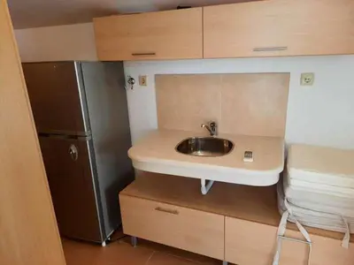 a small kitchen with a sink and a refrigerator at Sunny Villa in Byala