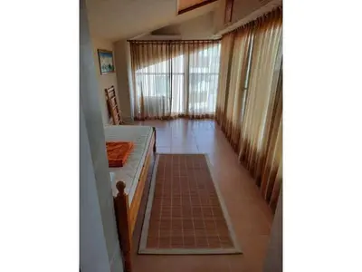 a hallway of a house with a room with windows at Sunny Villa in Byala