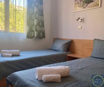 a bedroom with two beds with towels on them at 2 Bed Apt at Watermill Complex in Sveti Vlas
