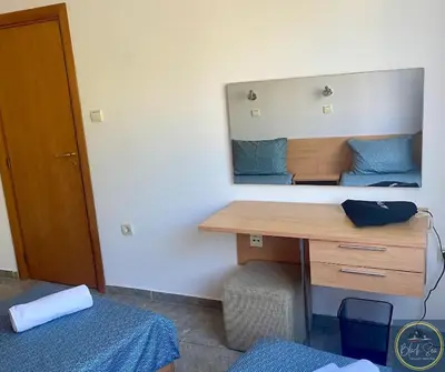 a room with a desk and a mirror on the wall at 2 Bed Apt at Watermill Complex in Sveti Vlas