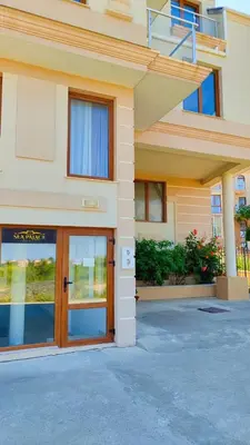 a building with a door with the letter b on it at Апартаменты Мисаря in Sozopol