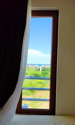 a window in a room with a view at Апартаменты Мисаря in Sozopol