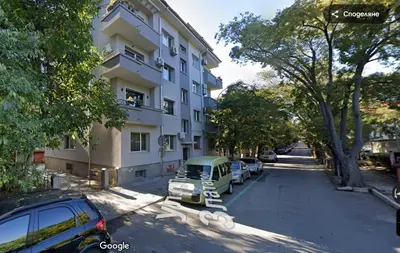 a car parked in front of a building at GRAND STUDIO SEA GARDEN - top center in Burgas City