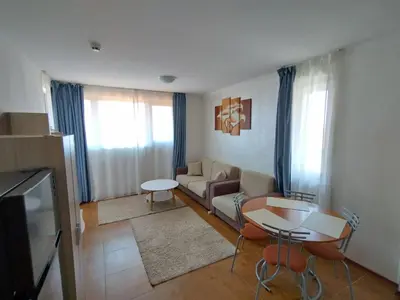 a living room with a couch and a table at Bay View Villas apartment NONA 1C - Kosharitsa in Kosharitsa