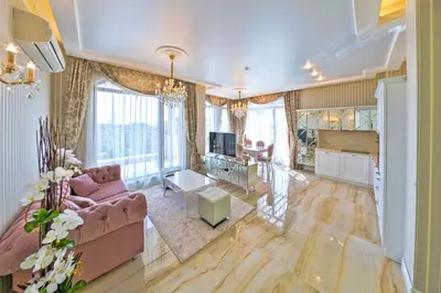 a living room with a couch and a table at Harmony Suites - Monte Carlo in Sunny Beach