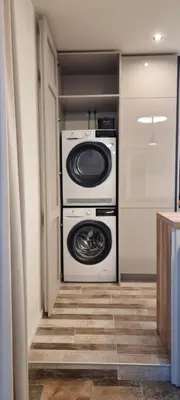 a laundry room with a washer and dryer at Kate`s Place in Burgas City