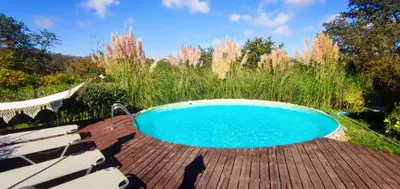 a swimming pool on a wooden deck at Casa Alegra in Bliznatsi