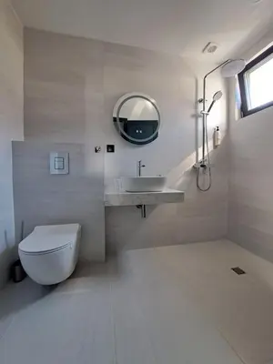 a bathroom with a toilet and a sink and a mirror at Villa Felicity, private pool with heating and salt water in Lozenets