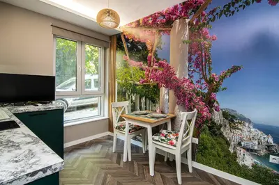 a kitchen with a table with a view of the city at Tiny studio in center of Varna in Varna City