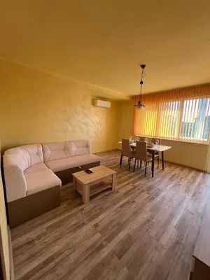 a living room with a couch and a table at Varna Top Central Apartment-Tulip in Varna City