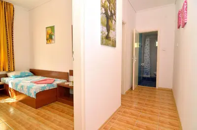 a small room with a bed and a hallway at BulgariaVilla - Royal Villas in Bryastovets