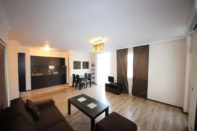 a living room with a couch and a table at Menada Dune Residence Apartments in Sunny Beach