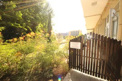 a fence in front of a house with a sign on it at Menada Dune Residence Apartments in Sunny Beach