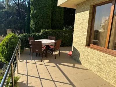 a patio with a table and chairs on a balcony at Apartment Sunny Seasons Byala in Byala