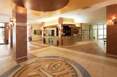 a lobby of a building with a mosaic on the floor at Yavor Palace Hotel - All Inclusive in Sunny Beach