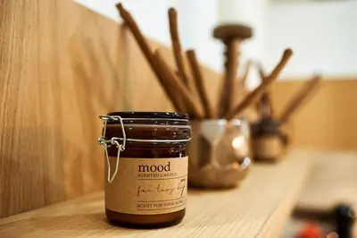 a jar of wood on a table with a plant at Studio in the Center of Burgas next to the See in Burgas City