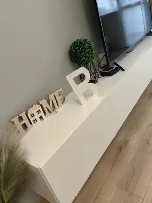 a white table with a sign that readsarma at Апартамент BLUE CREAM in Burgas City