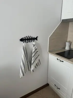 a kitchen with two pillows hanging on a wall at Heritage in Oasis Resort Lozenets in Lozenets