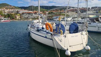 a white boat is docked in a harbor at Apartament w Bułgarii in Sveti Vlas