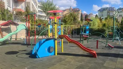 a park with a playground with a slide at Apartament w Bułgarii in Sveti Vlas