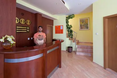 a man standing in the lobby of a hospital at Sunny Flower Family Hotel in Sunny Beach