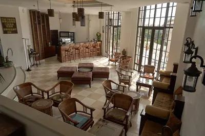 a living room with a bunch of chairs and tables at The Cliff Lux Apartment Obzor, Burgas, Bulgaria in Obzor