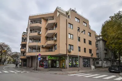 a tall building on the corner of a street at Central gem for 2 next to beach in Varna City