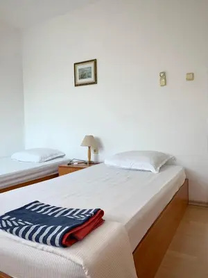 a bedroom with a bed with a blanket on it at Тедис хоум in Burgas City