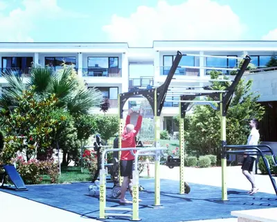a group of people playing on a playground at Apolonia Resort in Sozopol