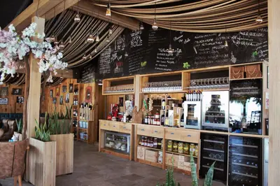a wine shop with a menu on the wall at Apolonia Resort in Sozopol