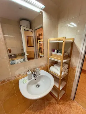 a bathroom with a sink and a mirror at Paradise Dreams Studio in Sveti Vlas