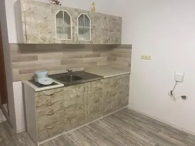 a kitchen with a sink and a counter at Краун Форт in Sveti Vlas