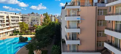 an aerial view of a building with a swimming pool at Apartament Amelia in Sunny Beach