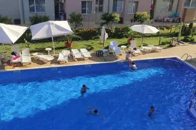 a group of people swimming in a swimming pool at Best Location in Sunny Beach Amber Beach in Sunny Beach