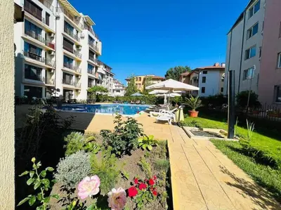 a view of a swimming pool and some buildings at Best Location in Sunny Beach Amber Beach in Sunny Beach