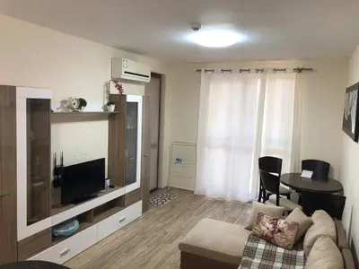 a living room with a couch and a table at Cascadas in Ravda