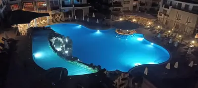 an overhead view of a swimming pool at night at Vineyard Spa Resort 2-Room Apartement in Kableshkovo
