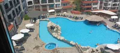 an overhead view of a swimming pool in a hotel at Vineyard Spa Resort 2-Room Apartement in Kableshkovo