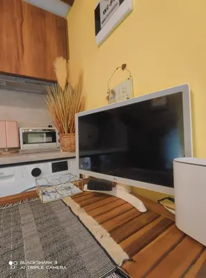 a large computer monitor sitting on top of a table at Tiny House in the center of Varna in Varna City