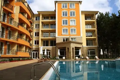 a swimming pool in front of an apartment building at Marvel Delux Private Studio in Sunny Beach