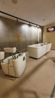a bathroom with two sinks and a bath tub at Poseidon Nessebar Private Apartment in Nesebar