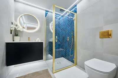 a bathroom with a shower with a toilet and a sink at Apartment Hristo in Pomorie