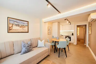 a living room with a couch and a table at Apartment Hristo in Pomorie